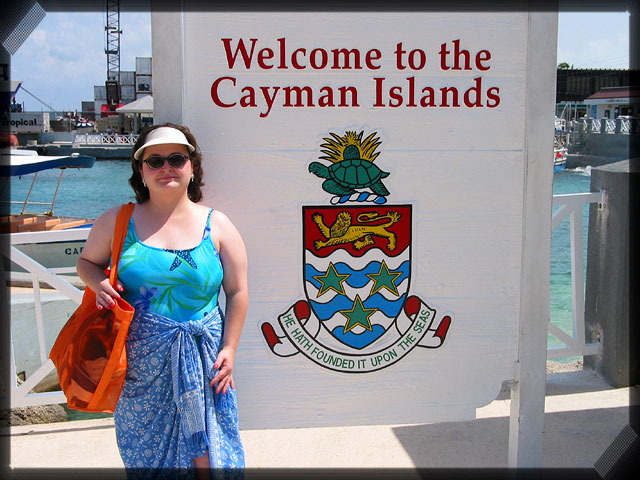 Becky Beside Cayman Islands Welcome Sign