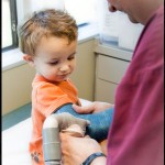 Watching the saw cut away his cast