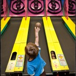 Playing Skee-Ball at Chuck E. Cheese’s