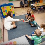 I think it’s a rooster that Mrs Eileen is handing Max at his preschool’s split session