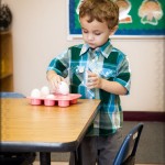 Lining up some eggs in his classroom