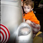 Playing on the Cat in the Hat car at Monkey Joe’s