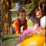 Max & Mama crawl under a horse made from hay outside of Dixie Stampede in Pigeon Forge