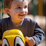 Riding a duck on the playground at Zoo Atlanta