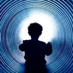 Sliding down a spiraled pipe at Washington Farms