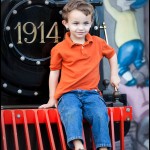 Sitting atop a steam engine's cow catcher in the Christmas Village in Pigeon Forge